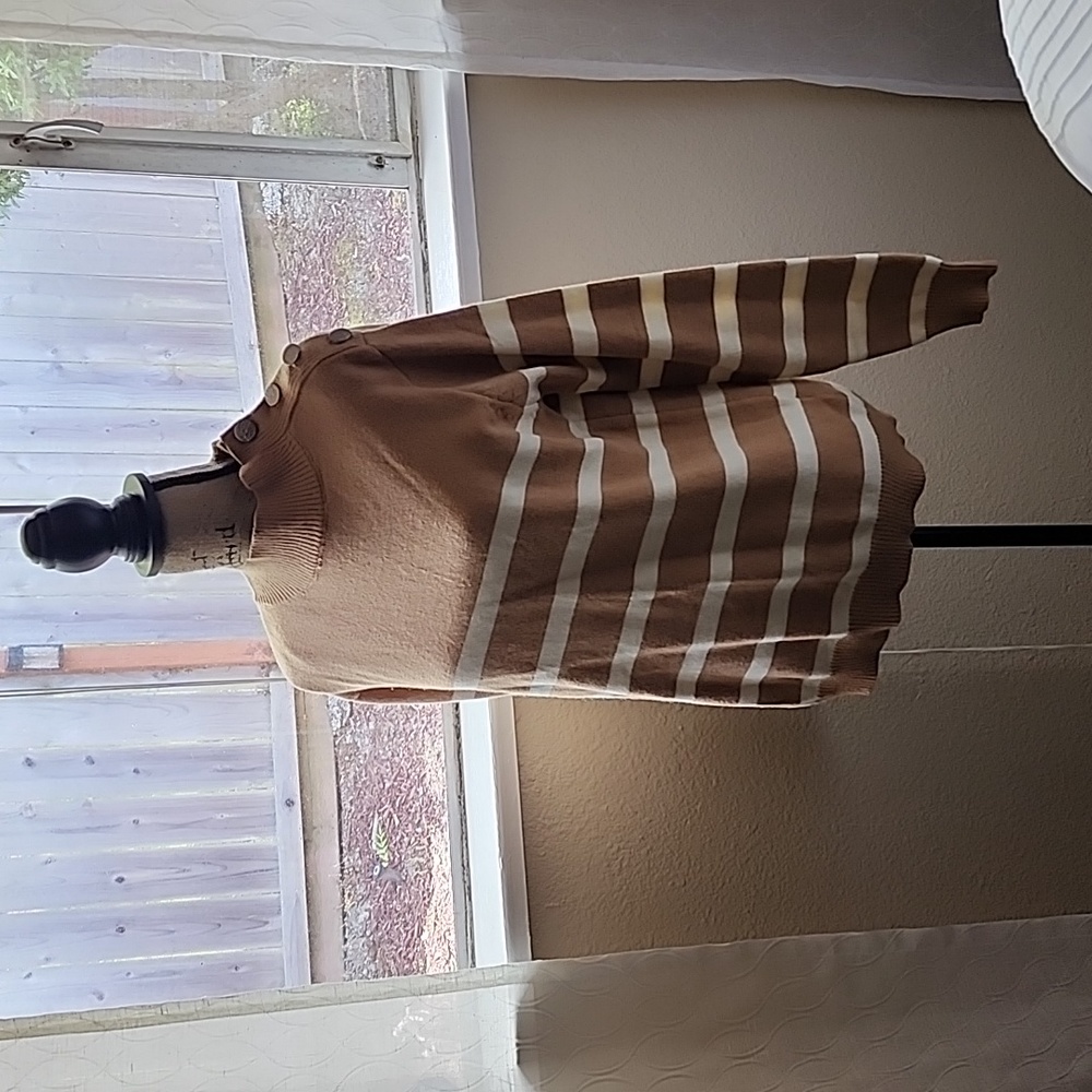 Sweater with gold buttons on right shoulder